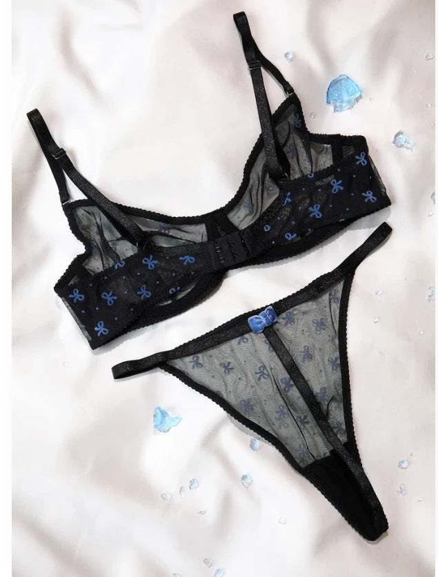 Back view of the black bow print mesh bra and thong set showing hook closure and bow detail